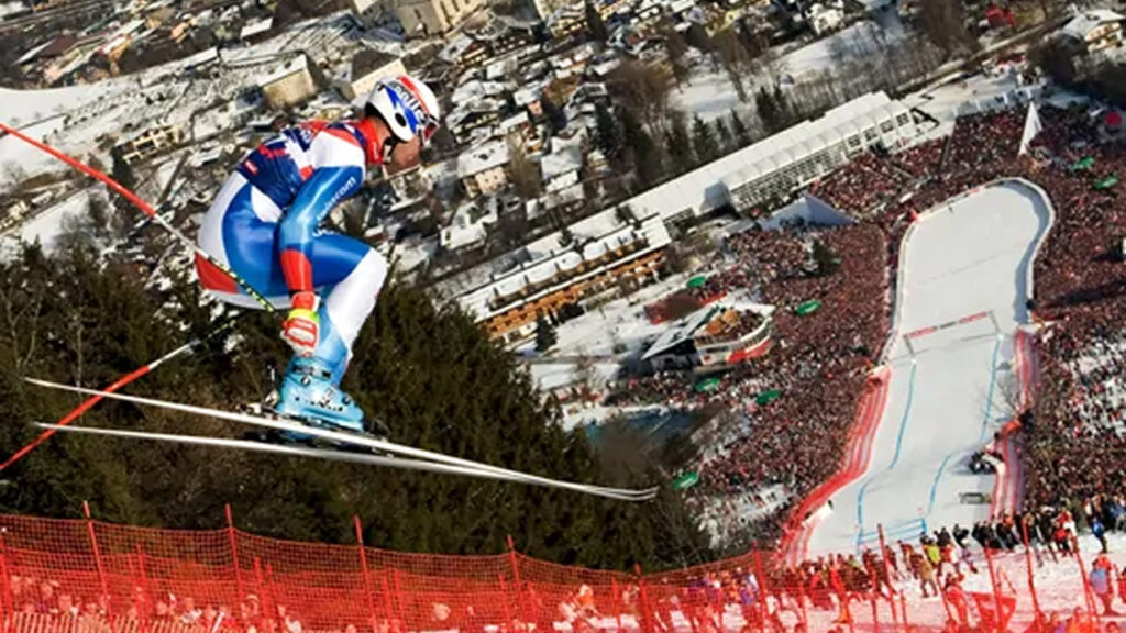 A man doing downhill ski race
