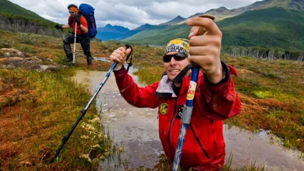A man posing for a picture while hiking