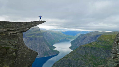 Man standing on the cliff enjoying the view