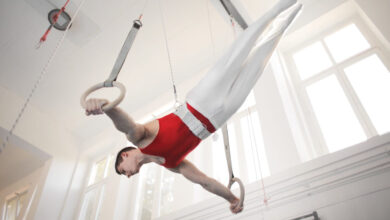 Photo of Male Gymnast Practicing on Gymnastic Rings