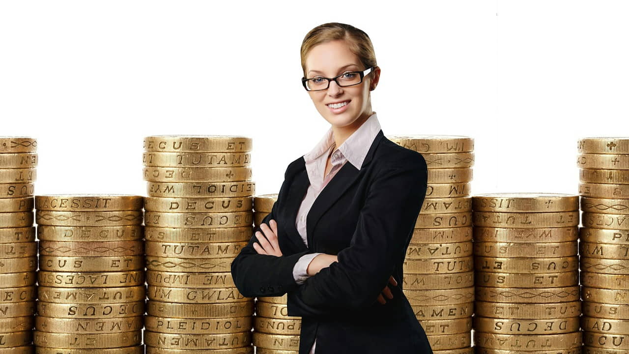 a business women standing in front of the stocks 