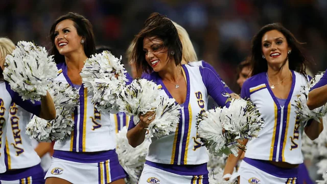 a team of nfl cheerleaders are performing 