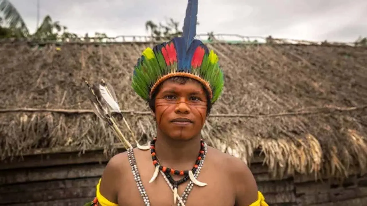 A boy is from the Tupi tribe of the Amazon rainforest