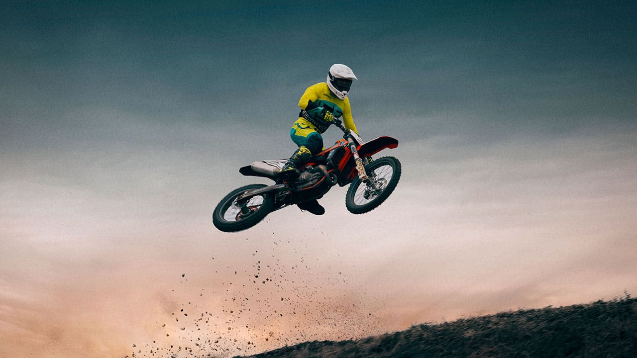 Ride is performing in-air action in MX racing