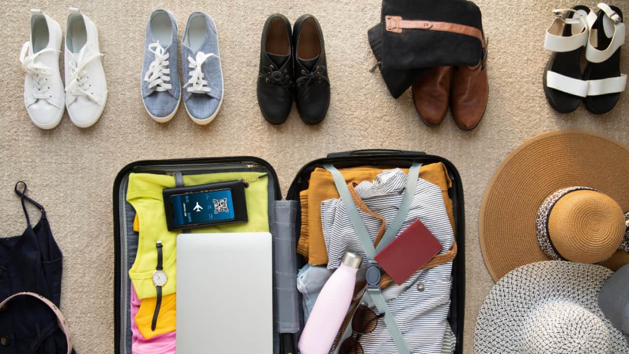 A variety of footwear and hats is needed for a digital nomad backpack