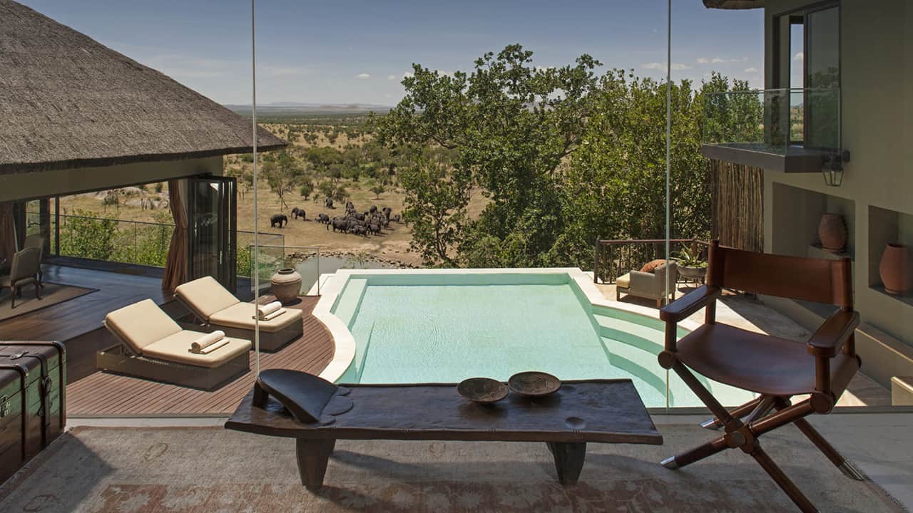 A lodge with high-end attractions like a swimming pool and a view of elephants