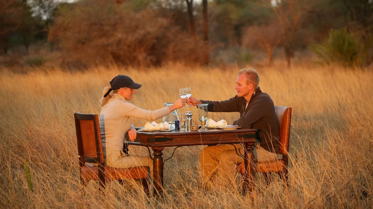 couple enjoying their drinks in a safari