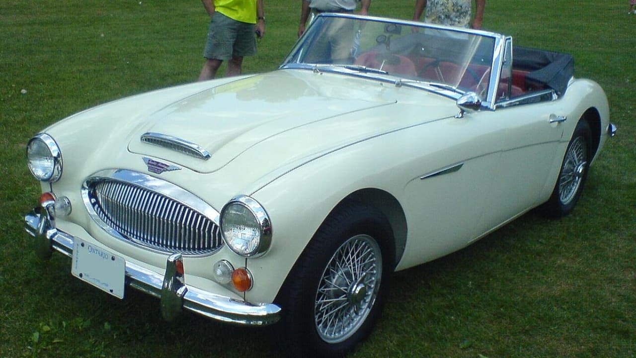 A 1959 Austin-Healey 3000 MKI is standing on the ground is a classic convertible car