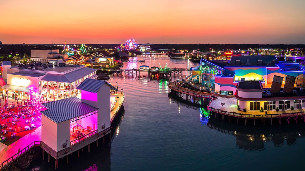 A top view of colorful Broadway at the beach offers various food options and shops