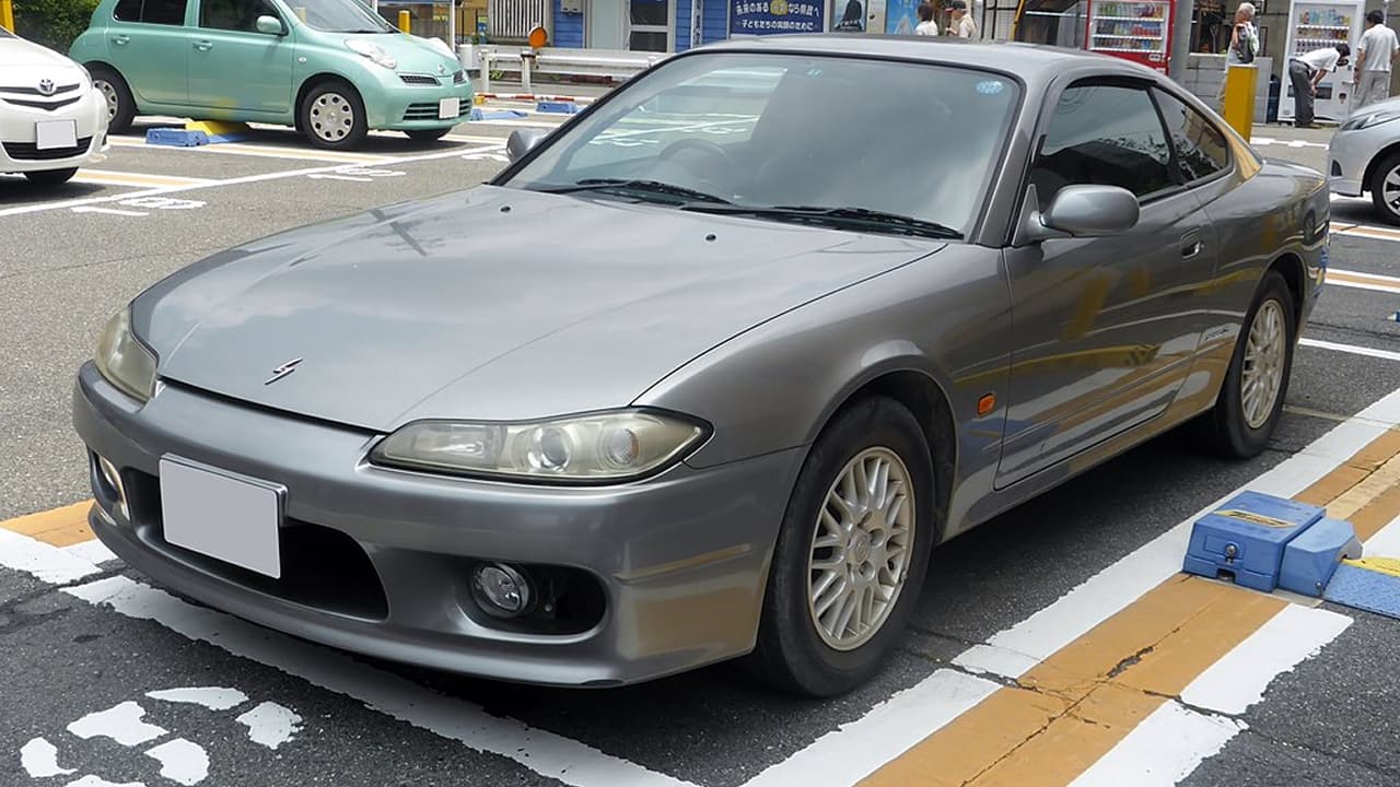 A Nissan Silvia S15 is parked on the side of the road