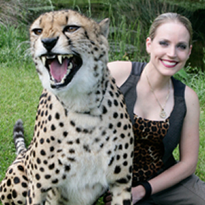 A girl is posing for a picture with a tiger in myrtle beach safari