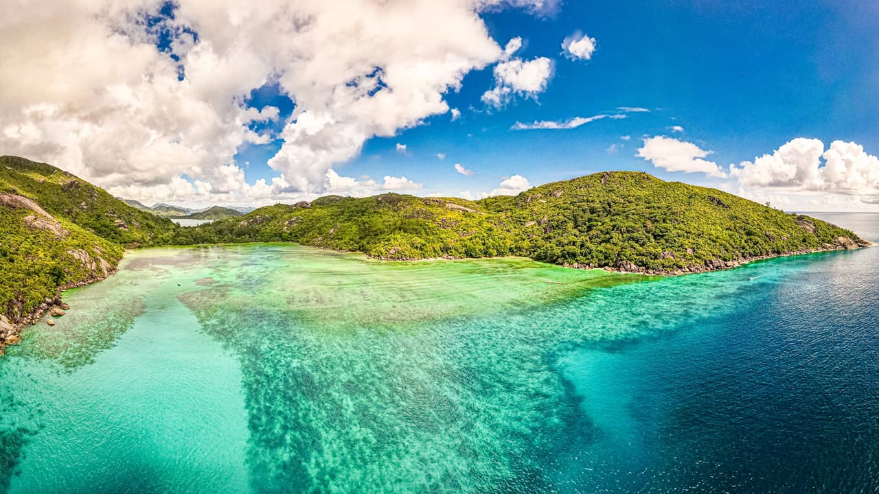 The sky is beautiful, and the view of Seychelles is stunning