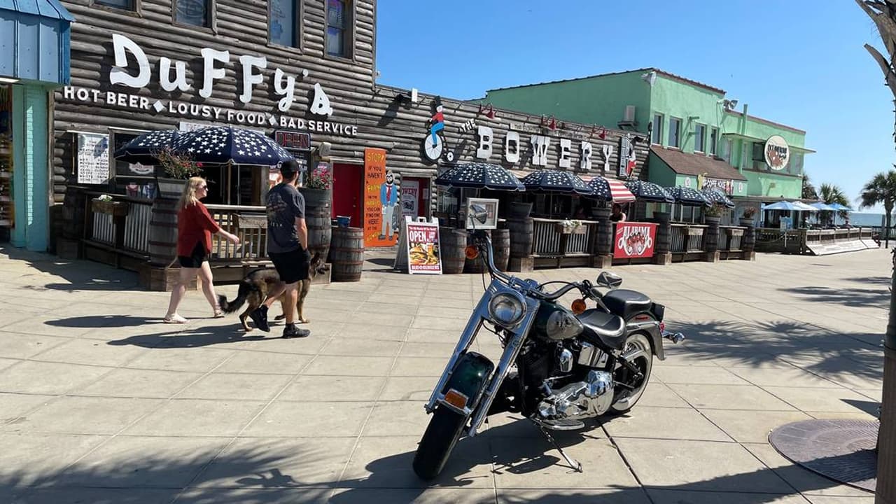 The outside view of the Bowery, where a couple is walking