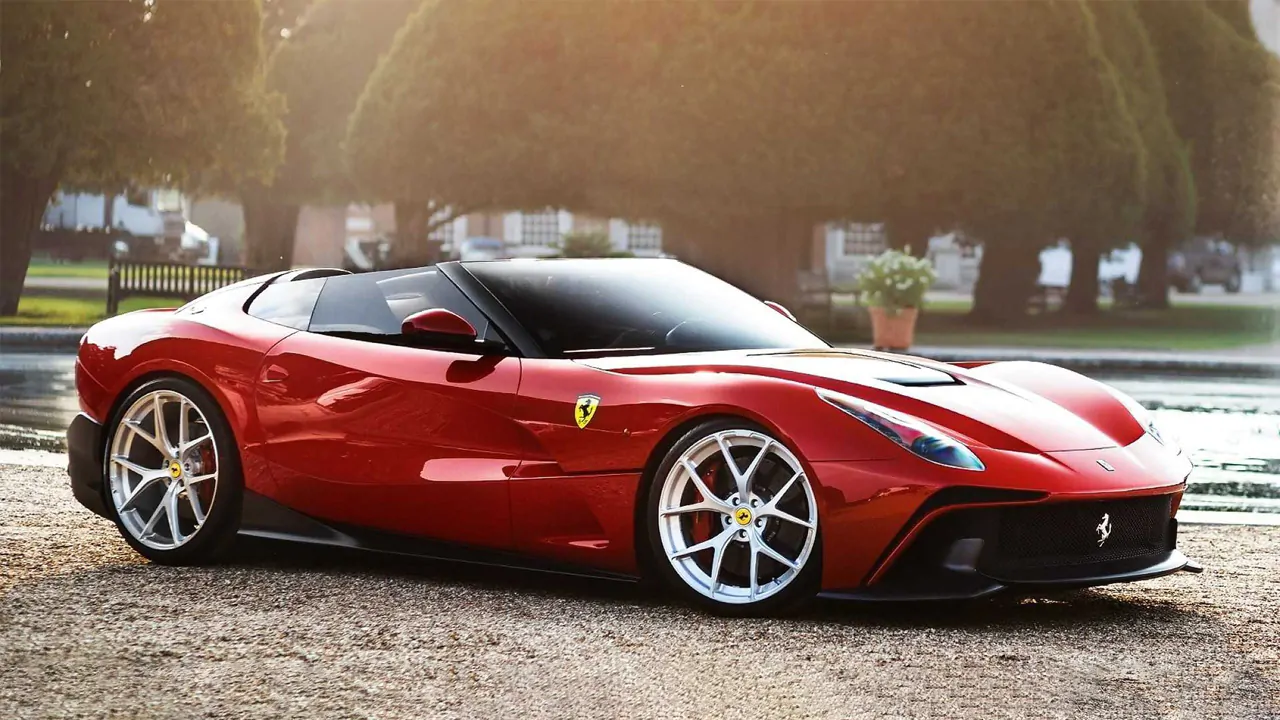 a blood red colored Ferrari F60 America in a park