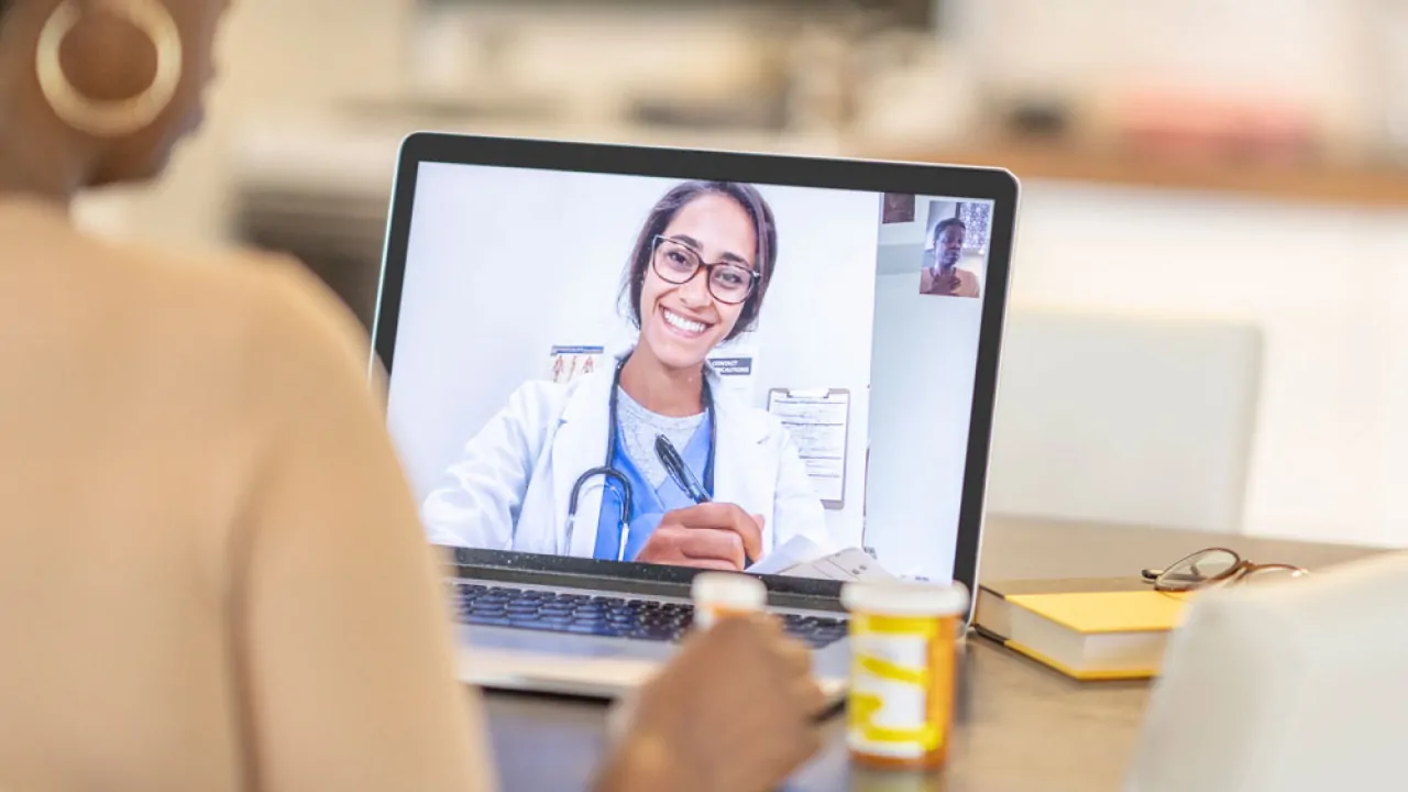 medical doctor is on video call with patient