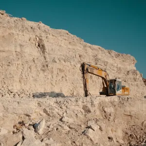 a crane is mining through mineral rich land