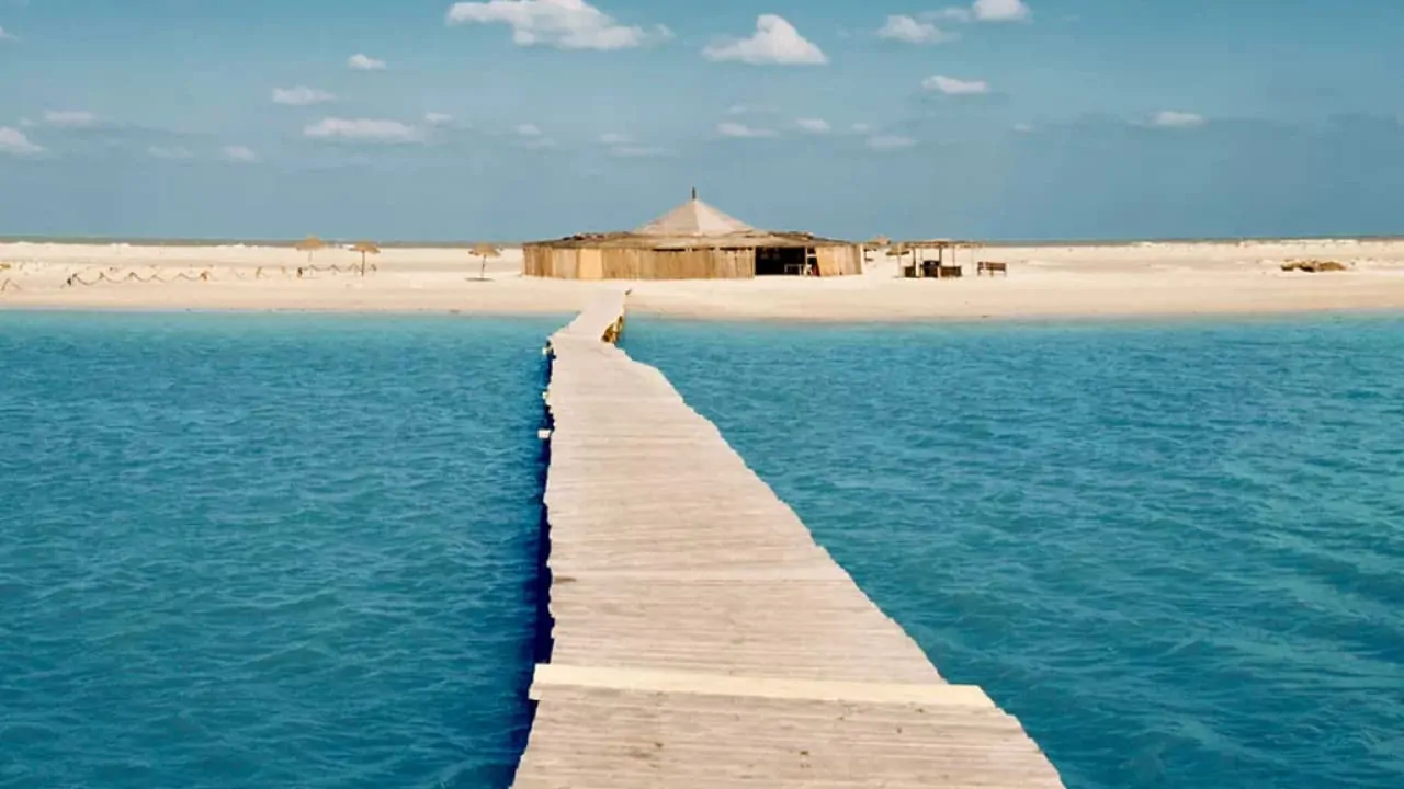 A long pathway over the water on Djerba Island which is in the list of top African islands to honeymoon